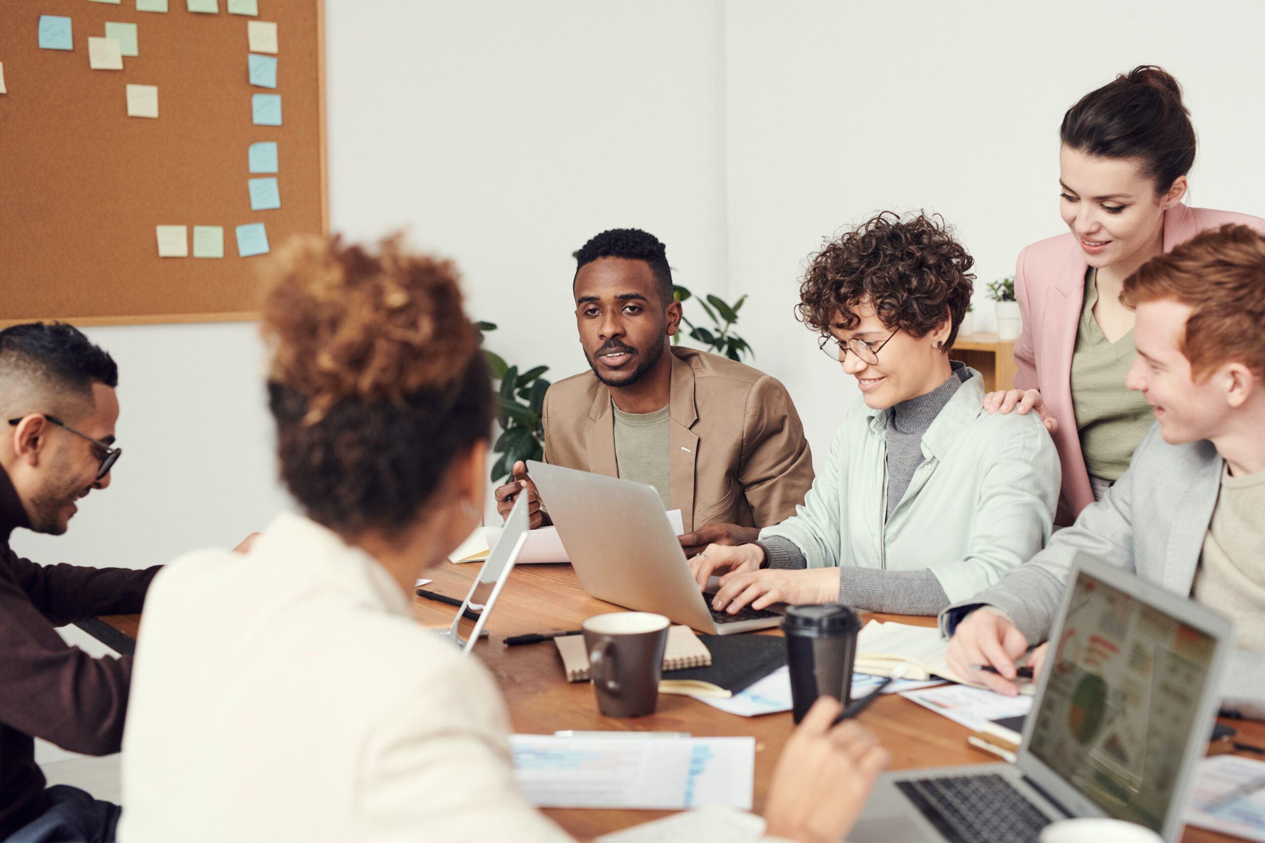 Three people working together in the office.